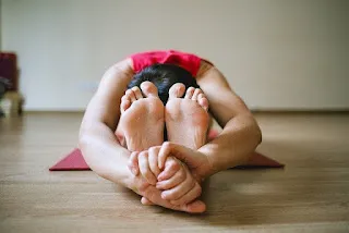 Knee to Forehead Stretch for shapely legs.